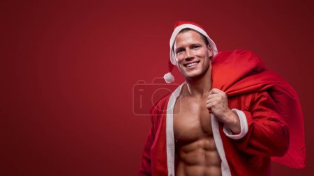 Photo for Joyful Santa with a sack over his shoulder, spreading Christmas cheer - Royalty Free Image