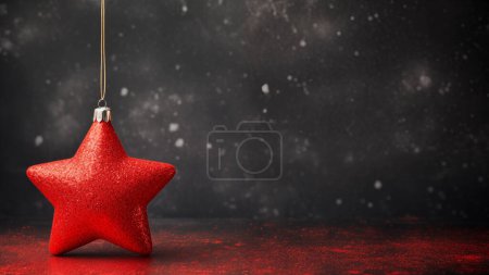 Photo for A single red Christmas star ornament hangs against a dark, star-filled backdrop with festive bokeh - Royalty Free Image