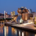 Bilbao, Spain - August 02, 2022: Sunset view of modern and contemporary art Guggenheim Museum and La Salve bridge