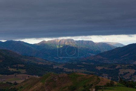 Photo for Mountain landscape, green valley along the Way of Saint James in the French Pyrenees. Clouds floating over the tops of the mountains. Landscape on the trail of Napoleon from France to Spain. High quality photo - Royalty Free Image