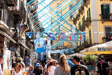 Photo for Naples, Italy - June 16, 2023: Naples champions of Italy, Blue and white celebration ribbons and flags on the street of Spaccanapoli in the city centre of Naples - Royalty Free Image