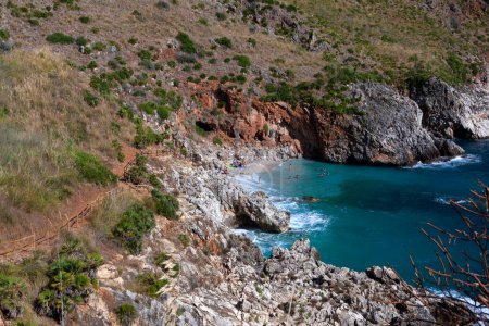 Paradise empty beach and turquoise sea named "Cala Capreria" at the Zingaro Nature Reserve in Italian called Riserva dello Zingaro, Scopello, Sicily, Mediterranean Sea, Italy
