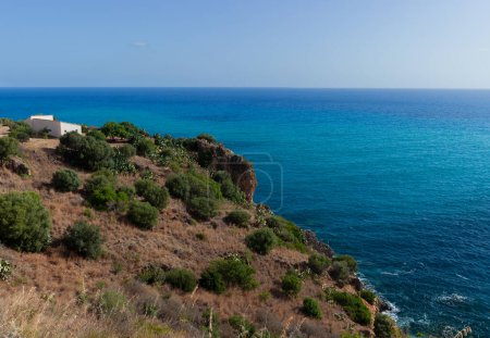 Paradise empty beach and turquoise sea named "Cala Capreria" at the Zingaro Nature Reserve in Italian called Riserva dello Zingaro, Scopello, Sicily, Mediterranean Sea, Italy