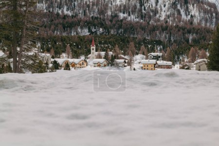 Saint Moritz, Switzerland - March 2024: Breathtaking mountains covered by snow around the Sils lake and Maloja village
