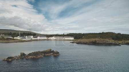2018.08.07 - Laphroaig distillery, Port town Ellen, Islay Island, United Kingdom, Europe. Closeup whiskey alcohol industry of Great Britain. Old building at ocean coast. Nobody nature seascape aerial