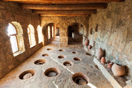 Wine cellar with kvevri wine pots at ancient Nekresi monastery winery in Kakheti. Kakheti is a region in eastern Georgia with Telavi as its capital.