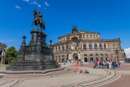 Photo for Dresden, Germany: State Opera House (Semperoper) and King Johann statue on Theaterplatz square - Royalty Free Image