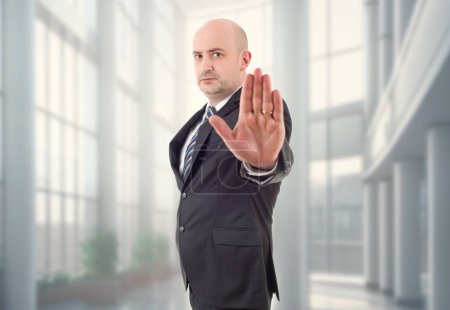 Photo for Business man making stop with his hand, at the office - Royalty Free Image