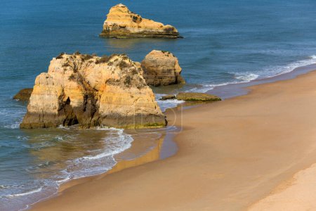 Photo for The famous beach of Praia da Rocha in Portimao. This beach is a part of famous tourist region of Algarve. - Royalty Free Image