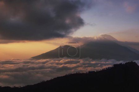 Photo for Scenic view of clouds and mist at sunrise from the top of mount Batur (Kintamani volcano), Bali, Indonesia - Royalty Free Image