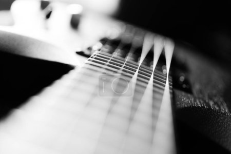 close up black electric guitar on black background