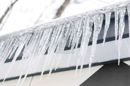 Photo for Icicles on the roof of the building - Royalty Free Image