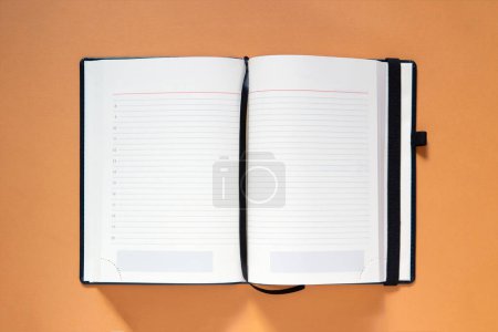 Photo for Blank white open book on orange background - Royalty Free Image