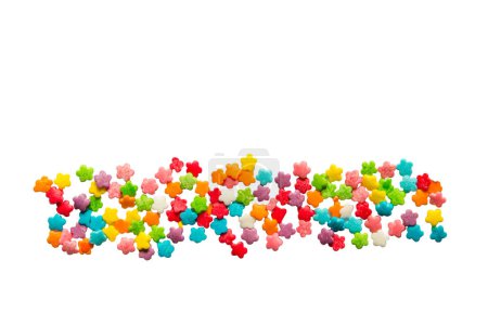 Foto de Salpicaduras de caramelo en todos los colores del arco iris aislado en blanco - Imagen libre de derechos