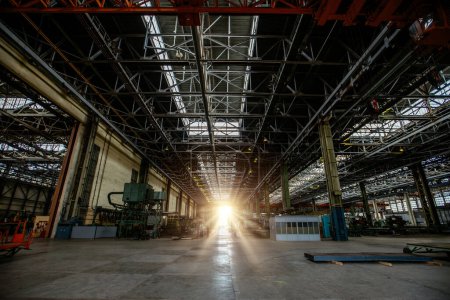 Photo for Heavy mechanical engineering factory production line. Interior of large worksop - Royalty Free Image