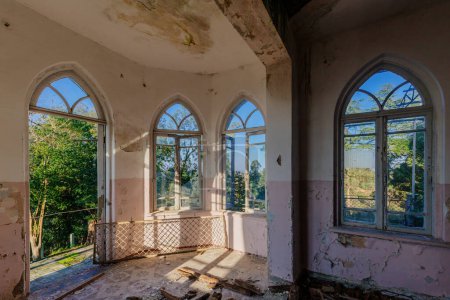 Photo for Old shabby room of abandoned mansion in gothic style. - Royalty Free Image