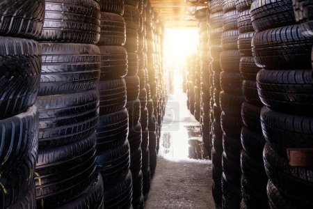 Photo for Stack of tires for sale in warehouse. - Royalty Free Image