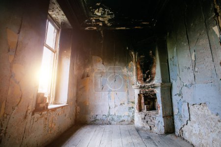 Photo for Burnt house interior fireplace and walls in black soot. - Royalty Free Image