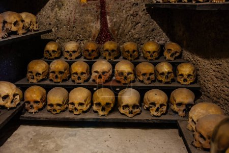 Photo for Human skulls in old crypt or catacombs. - Royalty Free Image