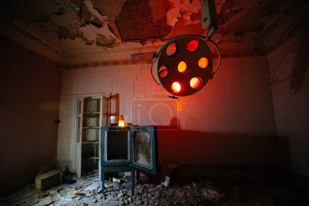 Photo for Sinister and creepy operating room in abandoned hospital. - Royalty Free Image