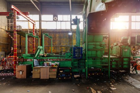 Photo for Pressing and packing of wastepaper in recycling factory. - Royalty Free Image