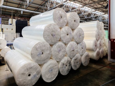 Photo for Packs of rolled foam rubber in warehouse. - Royalty Free Image