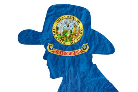 Téléchargez les photos : Silhouette de cow-boy avec drapeau Idaho sur fond de papier ridé - en image libre de droit