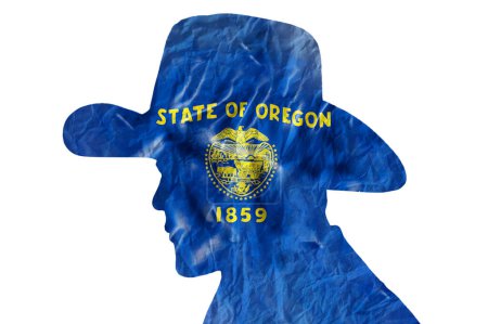 Téléchargez les photos : Silhouette de cow-boy avec drapeau de l'Oregon sur fond de papier ridé - en image libre de droit