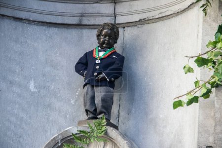Photo for Manneken Pis statue, pissing boy bronze sculpture. Manneken Pis one of the most popular tourist attractions in Brussels. - Royalty Free Image