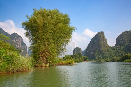 Photo for The Li River or Lijiang is a river in Guangxi Zhuang Autonomous Region, China. It flows 83 kilometres (52 mi) from Guilin to Yangshuo and famous for landscape formed by karst rocks. - Royalty Free Image