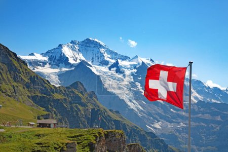 Photo for Swiss flag on the top of Mannlichen (Jungfrau region, Bern, Switzerland) - Royalty Free Image