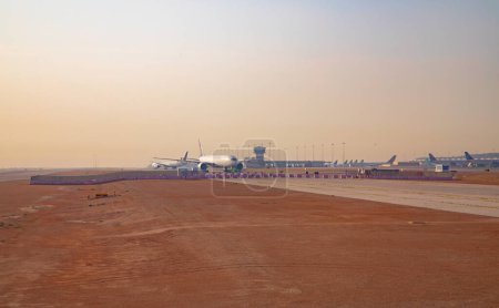 Riyadh - March 05:  Planes preparing for take off at Riyadh King Khalid Airport on March 05, 2023 in Riyadh, Saudi Arabia. Riyadh airport is home port for Saudi Arabian Airlines.