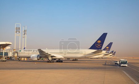 Photo for Riyadh - March 05:  Planes preparing for take off at Riyadh King Khalid Airport on March 05, 2023 in Riyadh, Saudi Arabia. Riyadh airport is home port for Saudi Arabian Airlines. - Royalty Free Image