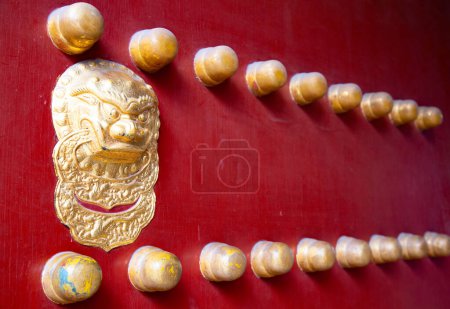 Photo for Traditional chinese palace entrance with lionhead decoration - Royalty Free Image