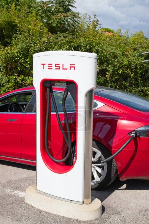 Photo for FORTE DEI MARMI, ITALY - September 21:  Tesla Supercharger station on September 21, 2021 in Forte dei Marmi, Italy. Tesla motors develops network of the charging stations across Europe and World. - Royalty Free Image