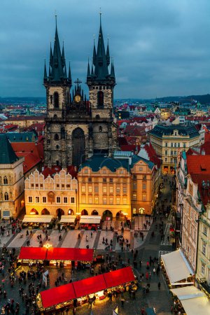 Aerial view of the Tyn church and famous Christmas market on the Old Town Square in Prague, Czechia.