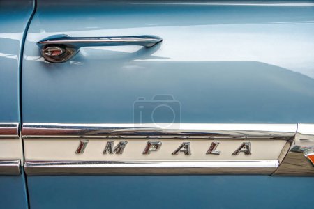 Photo for WETTENBERG, HESSE, GERMANY - 07 - 28 - 2023: IMPALA lettering on a car door at a Car Show Golden Oldies in Krofdorf-Gleiberg, near Giessen, Hesse. - Royalty Free Image