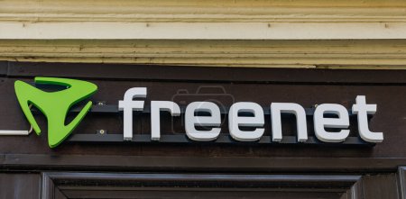 Photo for QUEDLINBURG, GERMANY - September 6, 2023:   Brand logo sign of the freenet AG on the gray store front facade in the city center, German company, mobile telecommunication and web content provider, copy space - Royalty Free Image