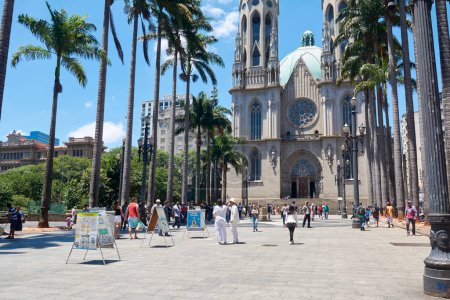 Photo for People walk around of Metropolitan Cathedral of Sao Paulo or Se Cathedral, located in Se Square, in the Sao Paulo city's central zone, Brazil. - Royalty Free Image