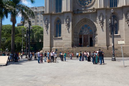 Photo for People walk around of Metropolitan Cathedral of Sao Paulo or Se Cathedral, located in Se Square, in the Sao Paulo city's central zone, Brazil. - Royalty Free Image