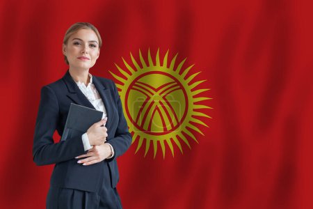 Foto de Kyrgyz businesswoman on the flag of Kyrgyzstan digital  nomad, business, startup concept - Imagen libre de derechos