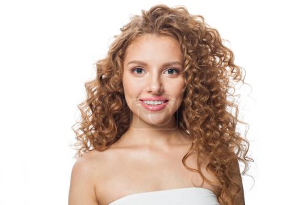 Photo for Friendly healthy model with natural make-up, shiny clear skin and long curly hairstyle. Haircare, Skincare, Cosmetology and Styling concept - Royalty Free Image