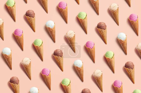 Photo for Colorful ice cream pattern on pastel orange background, top view, flat lay. Vanilla, chocolate, caramel, strawberry and pistachio flavors - Royalty Free Image