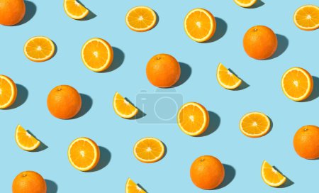 Photo for Colorful pattern of fresh ripe whole and sliced oranges. Minimal trendy sunlight fruit concept - Royalty Free Image