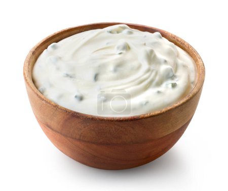 Photo for Wooden bowl of fresh sour cream dip sauce with herbs isolated on white background - Royalty Free Image