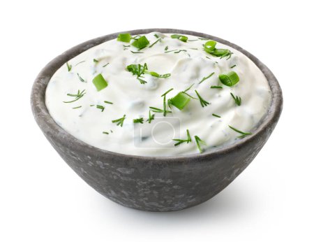 Photo for Dark grey ceramic bowl of fresh sour cream dip sauce with herbs isolated on white background - Royalty Free Image