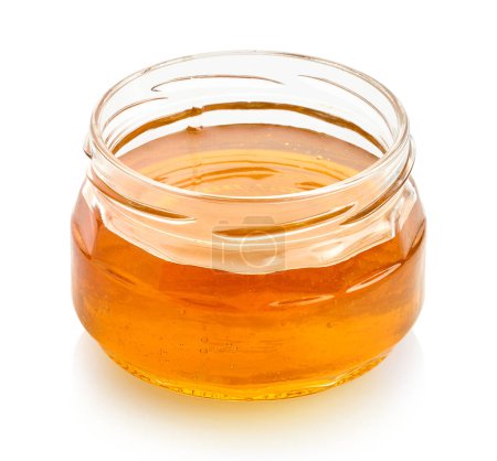 Photo for Glass jar full of honey isolated on white background - Royalty Free Image