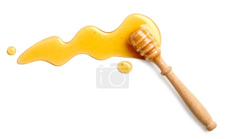 Photo for Honey splash with wooden honey dipper isolated on white background, top view - Royalty Free Image