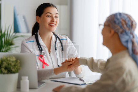 Photo for Colour ribbon for concept of illness awareness. Female patient listening to doctor in medical office. Raising knowledge on people living with disease. - Royalty Free Image
