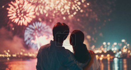 Photo for Happy loving couple watching fireworks. - Royalty Free Image